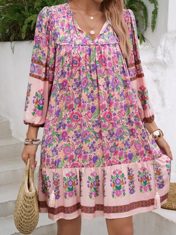 Devine Tassel Floral Tie Neck Mini Dress sold by Charming Charlie