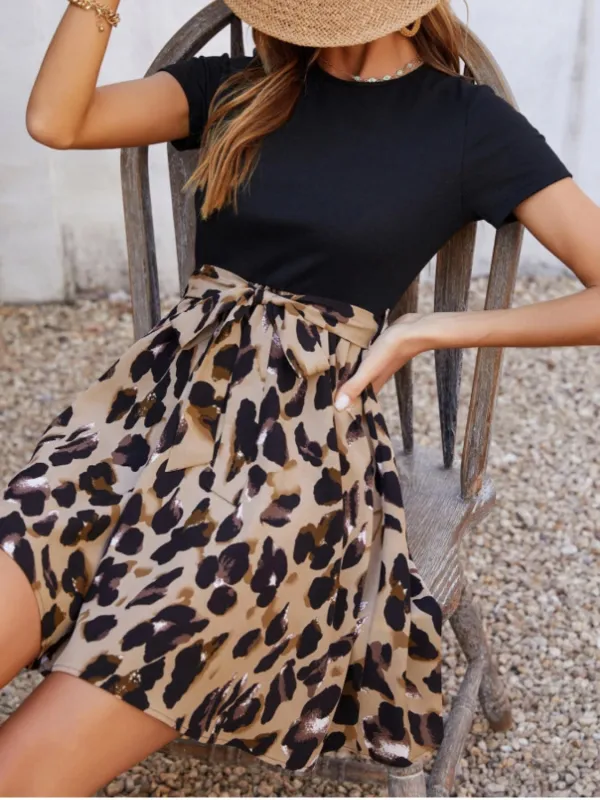 Tied Front Contrast Leopard Short Sleeve Mini Dress sold by Charming Charlie