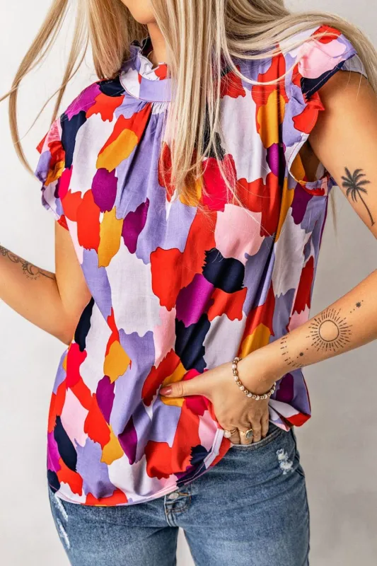 Frill Printed Mock Neck Cap Sleeve Blouse sold by Charming Charlie