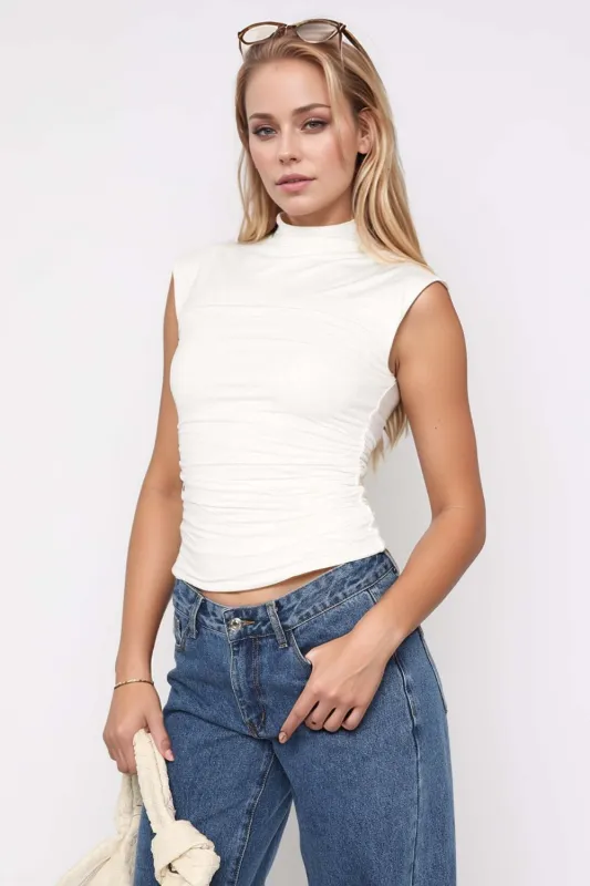 Mock Neck Ruched Tank sold by Charming Charlie