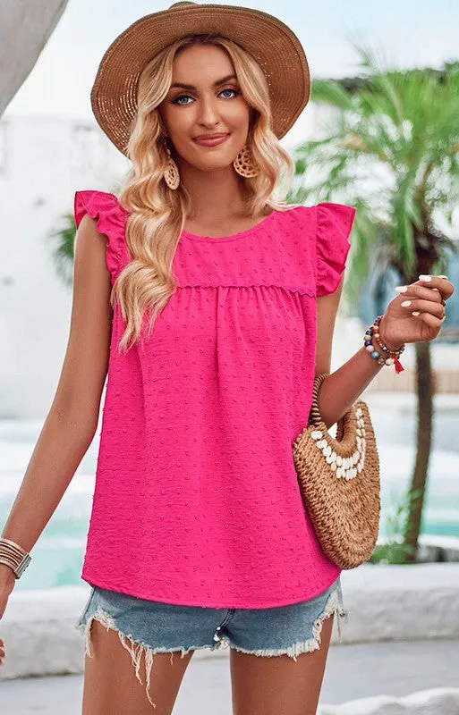 Swiss dot ruffled top sold by Charming Charlie