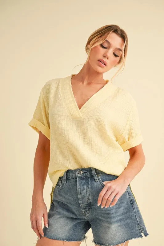 Aemi + Co Side Slit V-Neck Short Sleeve Blouse sold by Charming Charlie