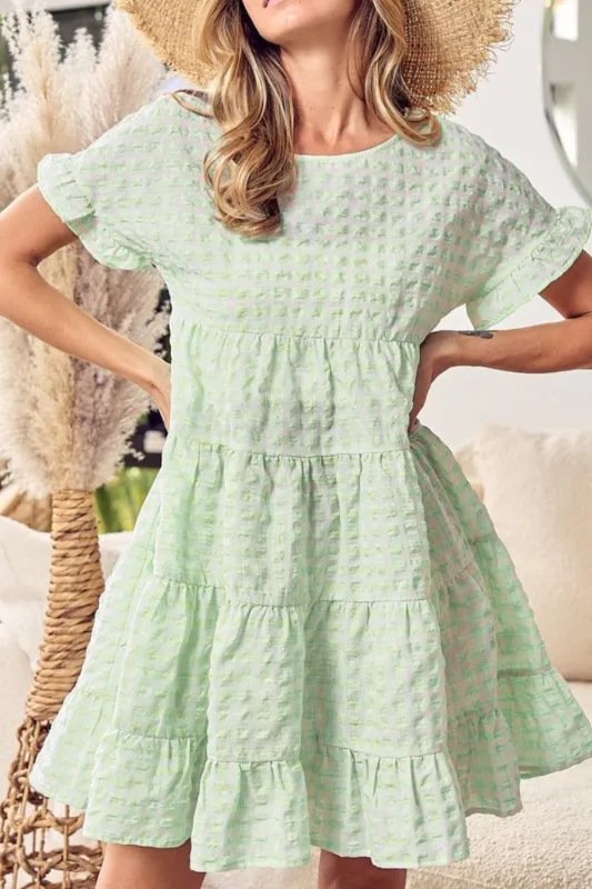 Textured Short Sleeve Tiered Mini Dress sold by Charming Charlie
