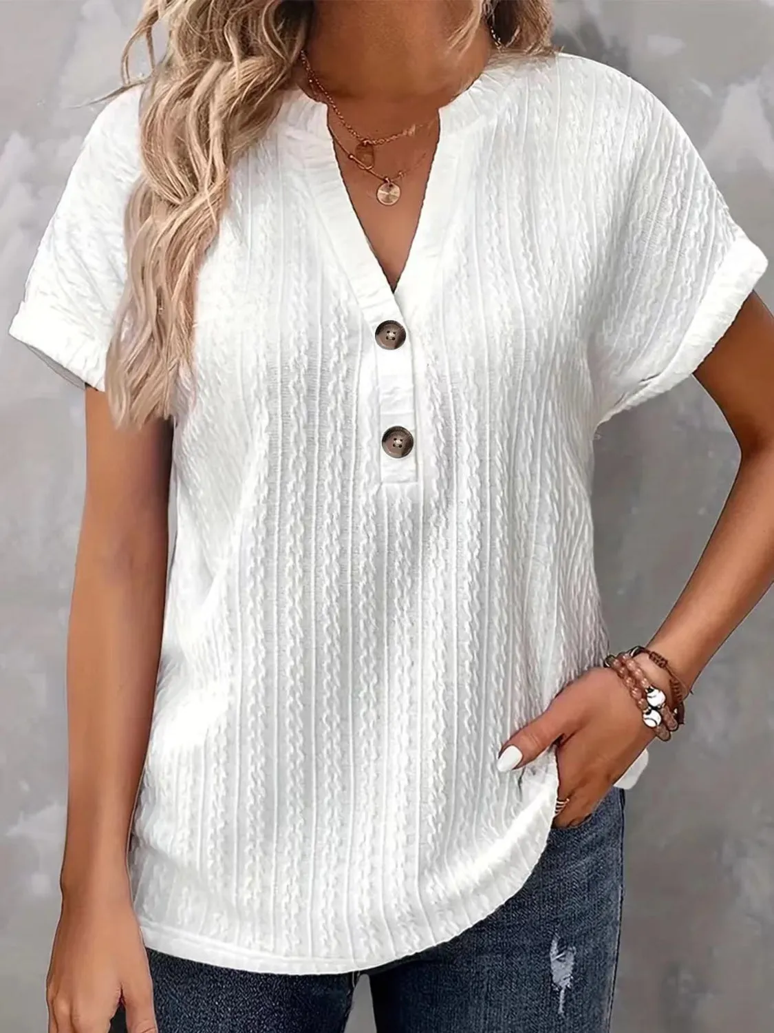 Textured Notched Short Sleeve Top sold by Charming Charlie