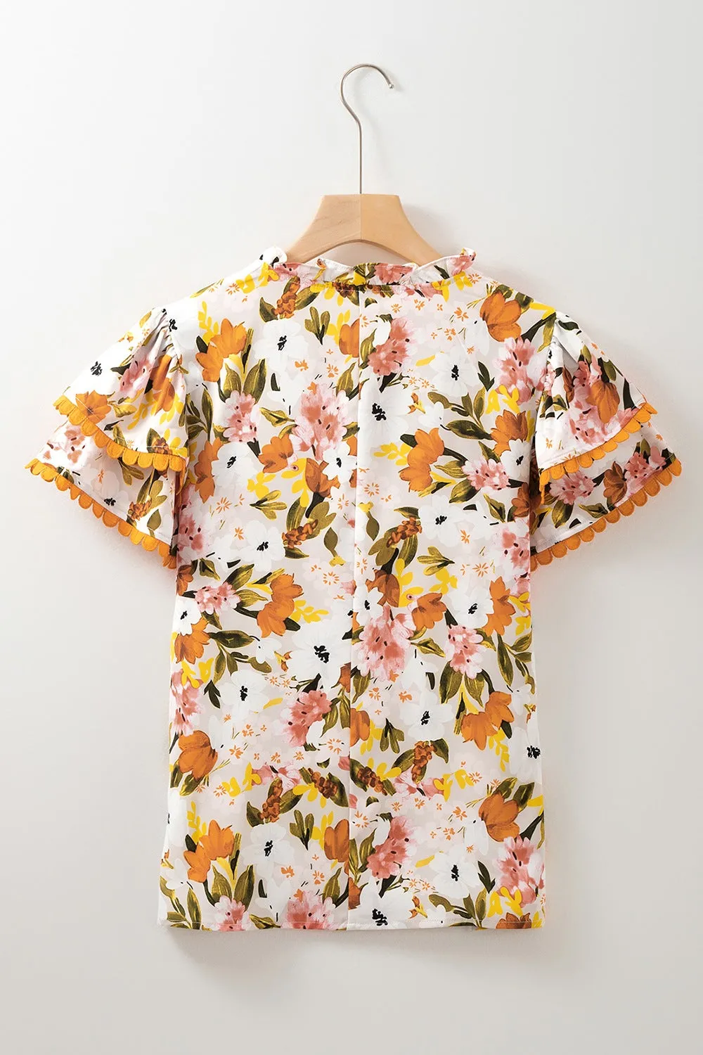 Ruffled Notched Short Sleeve Floral Blouse sold by Charming Charlie product image thumbnail 5