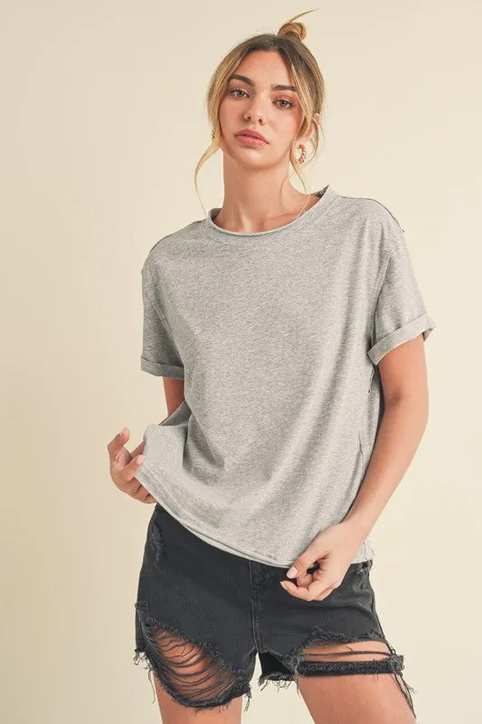 Aemi + Co Exposed Seam Round Neck Short Sleeve T-Shirt sold by Charming Charlie