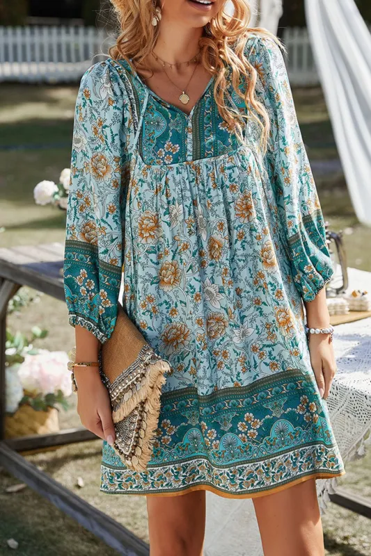 Devine Printed Tie Neck Mini Dress sold by Charming Charlie