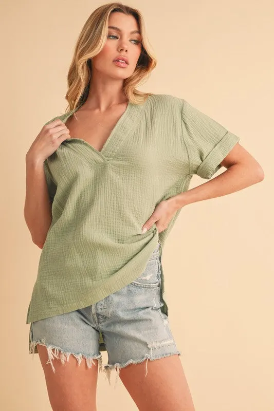 Aemi + Co Side Slit V-Neck Short Sleeve Blouse sold by Charming Charlie