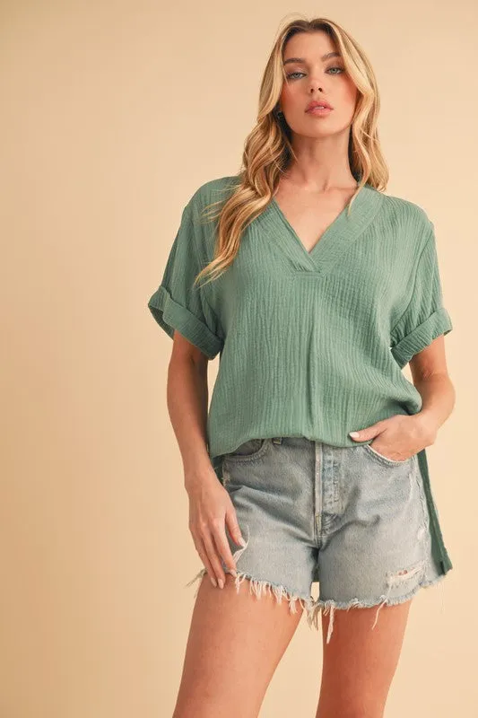 Aemi + Co Side Slit V-Neck Short Sleeve Blouse sold by Charming Charlie