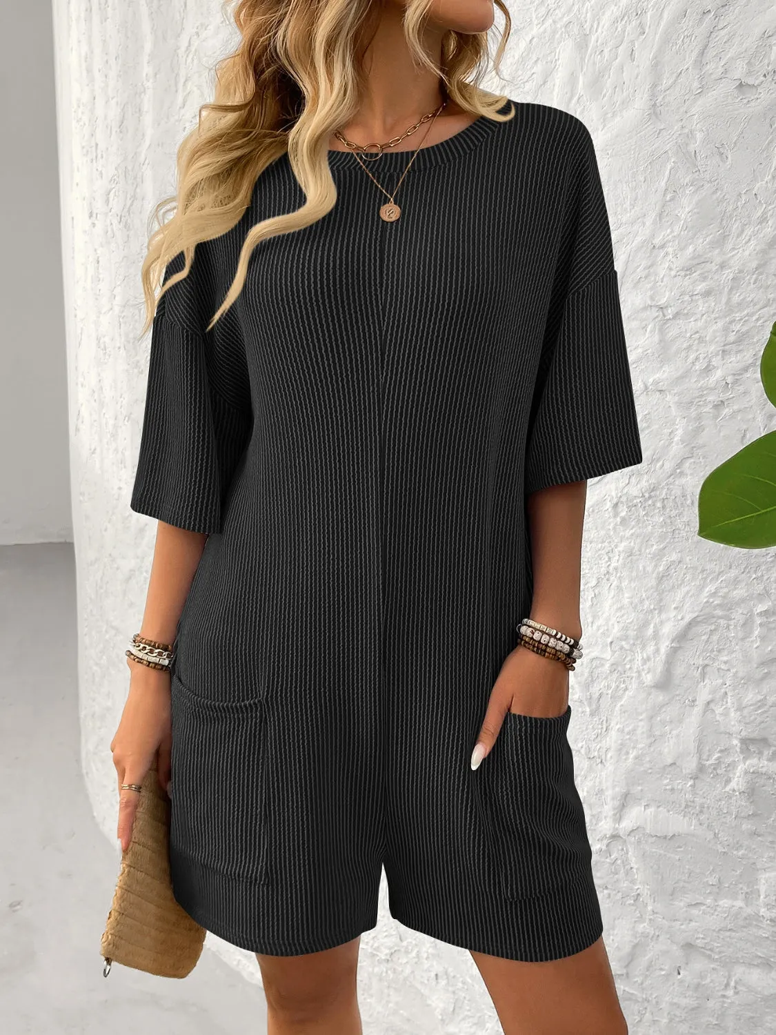 Backless Textured Round Neck Half Sleeve Romper sold by Charming Charlie