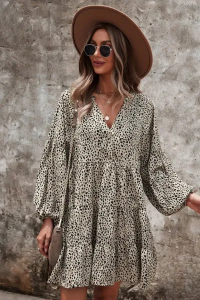 Dotted ruffled long sleeve tiered dress sold by Charming Charlie