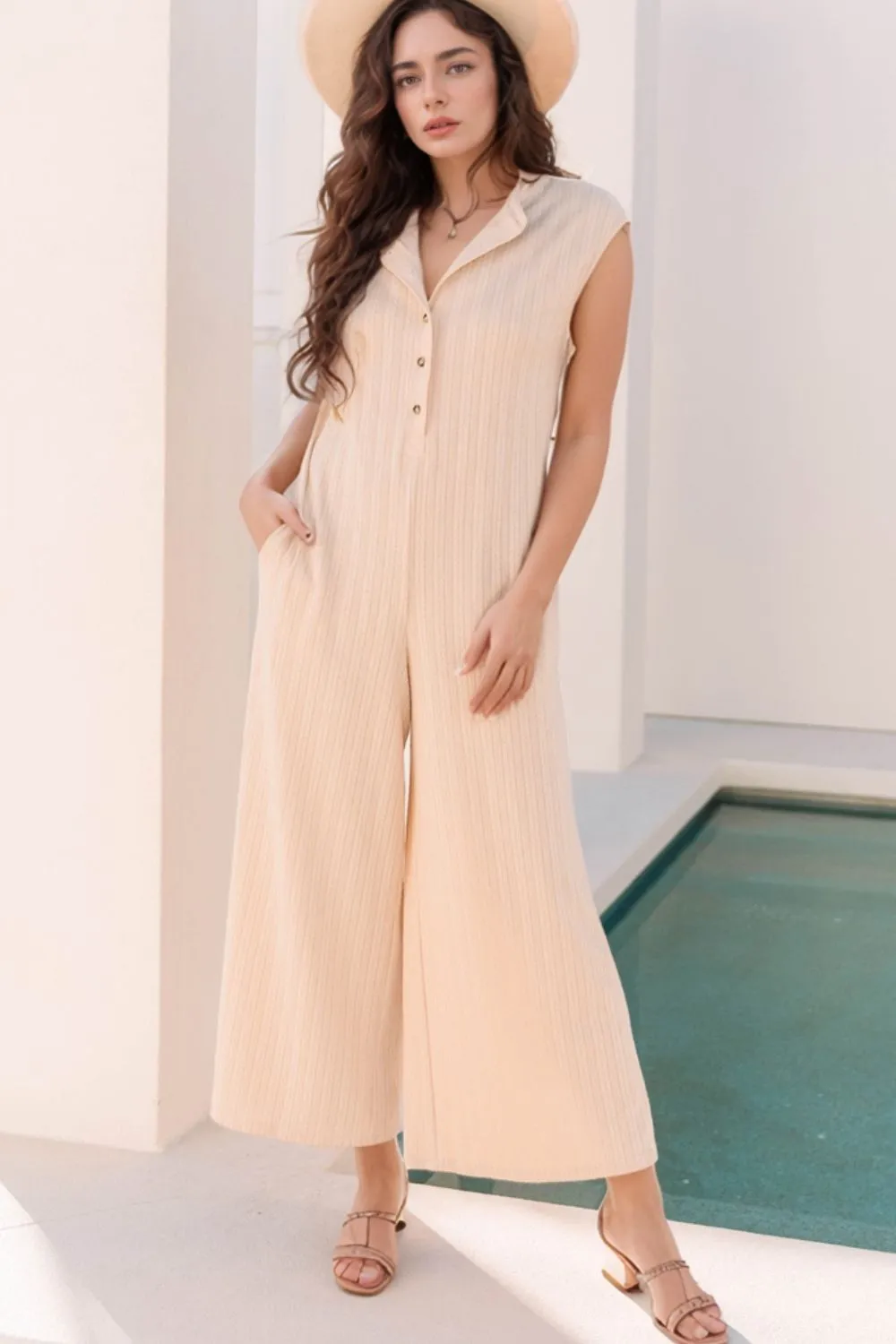 Textured Button Front Wide Leg Cap Sleeve Jumpsuit sold by Charming Charlie