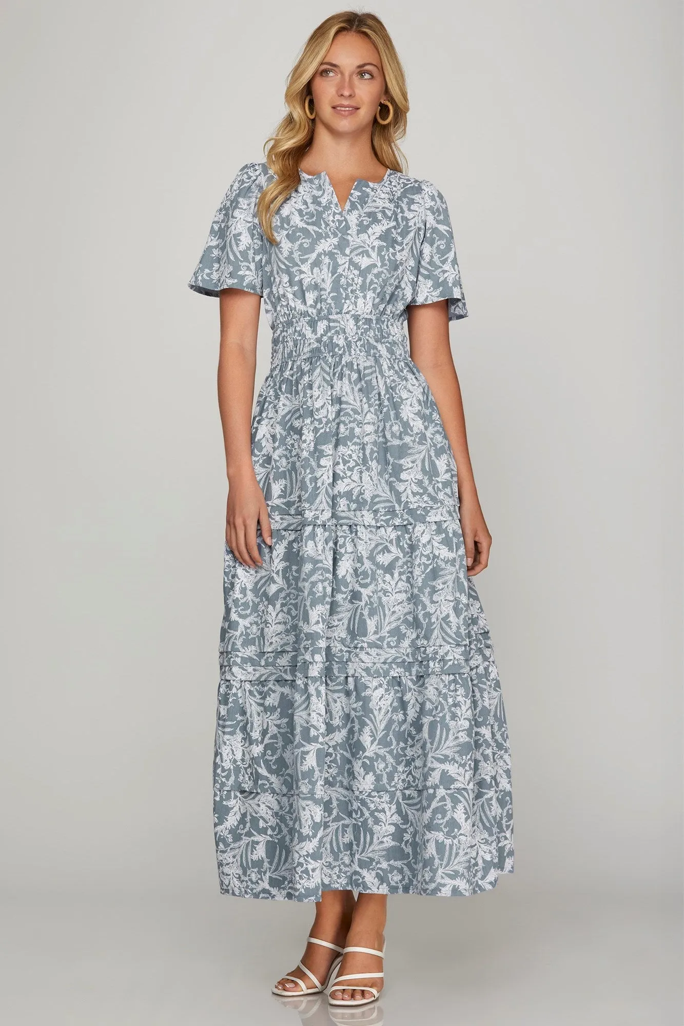She + Sky Printed Notched Woven Tiered Pintuck Maxi Dress with Side Pockets sold by Charming Charlie