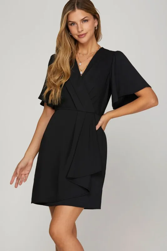 She + Sky Ruffled Surplice Short Flutter Sleeve Mini Dress sold by Charming Charlie