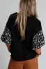 Contrast Floral Puff Sleeve Oversized Top sold by Charming Charlie