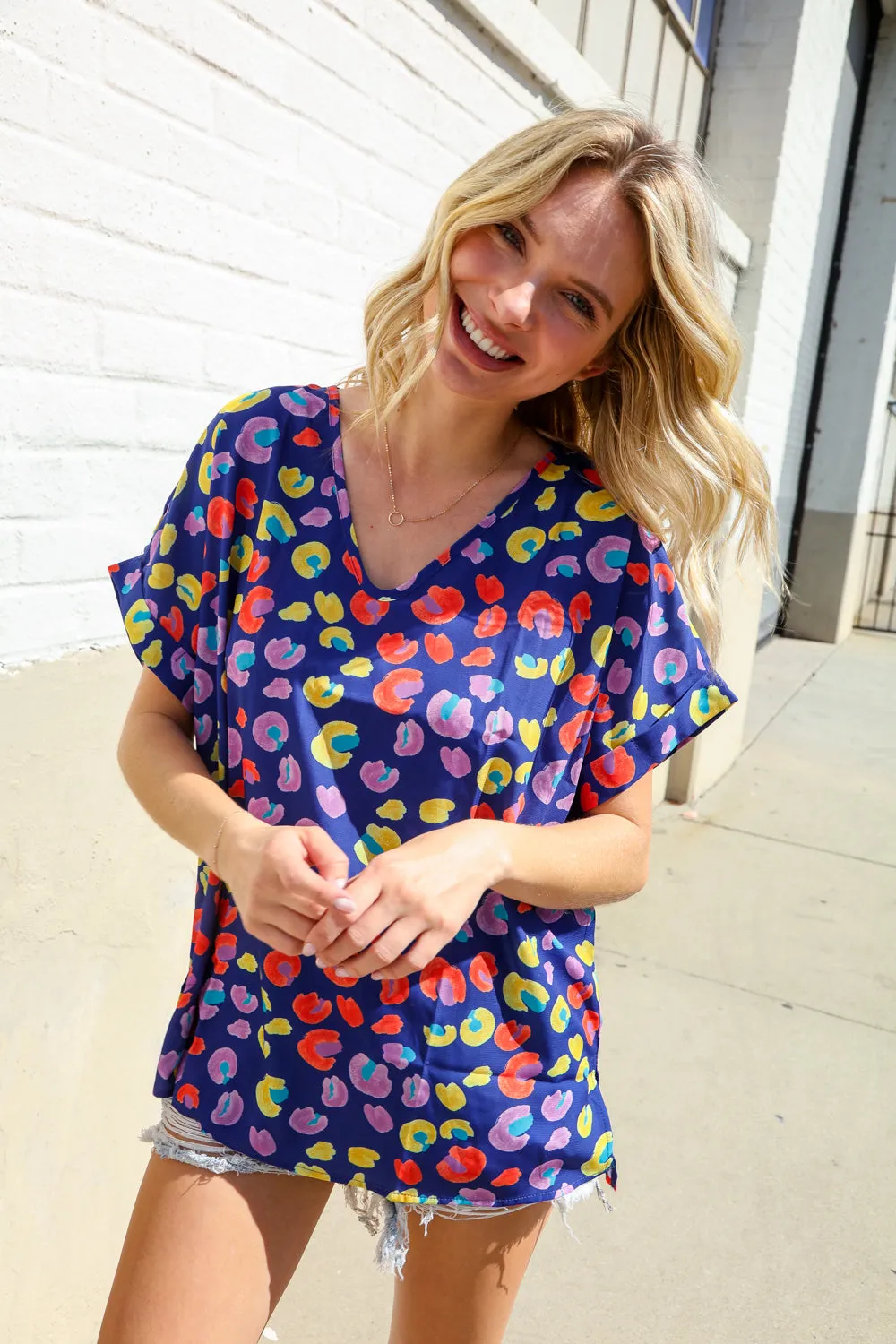 Follow Me Navy Blue Animal Print V Neck Dolman Hi-Lo Blouse sold by Charming Charlie