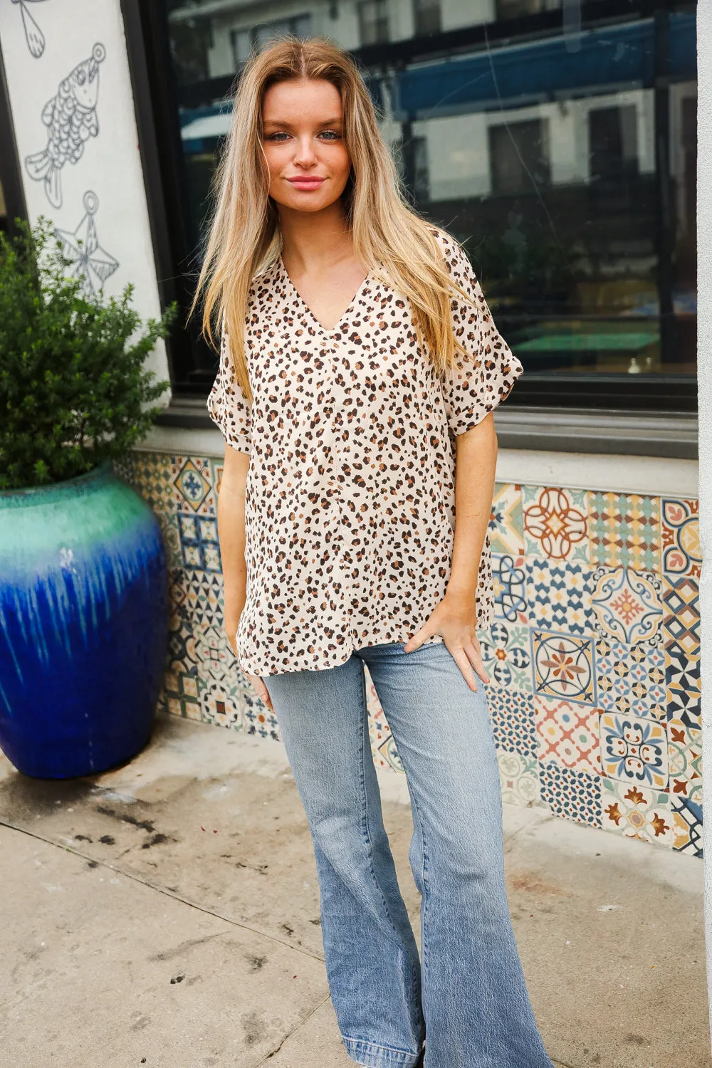 Best In Bold Ivory Animal Print V Neck Dolman Side Slit Top sold by Charming Charlie product image thumbnail 2