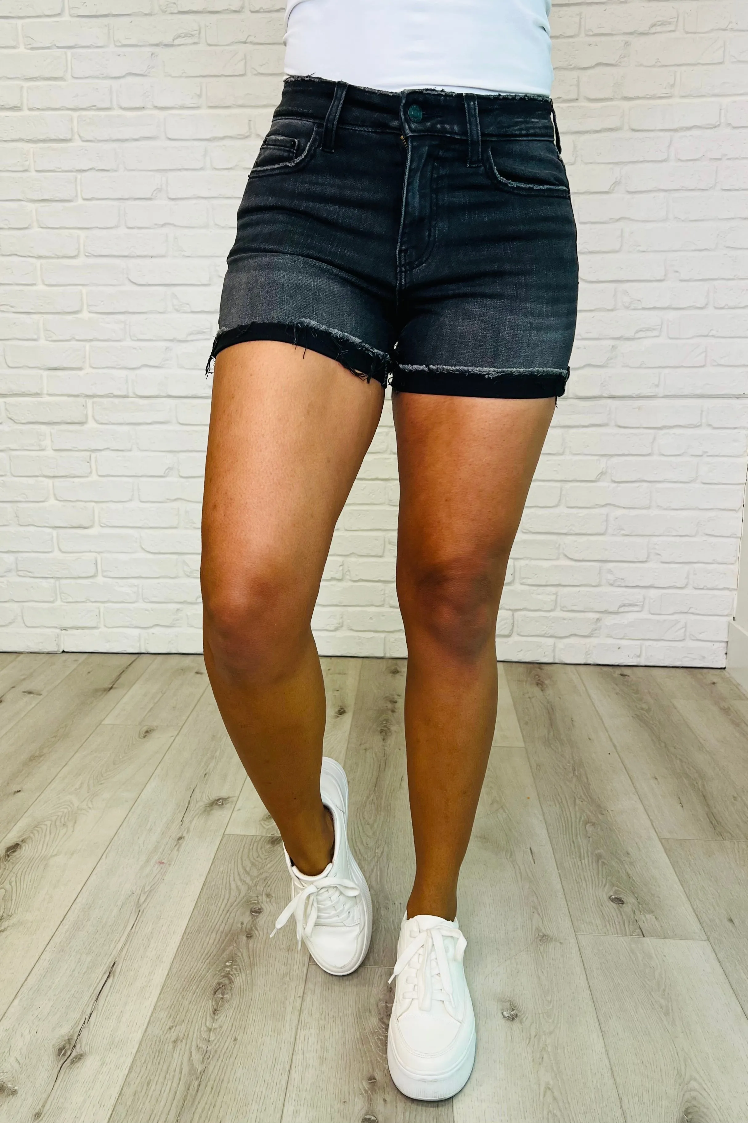 Sunset Stroll Distressed Hem Shorts in Washed Black sold by Charming Charlie