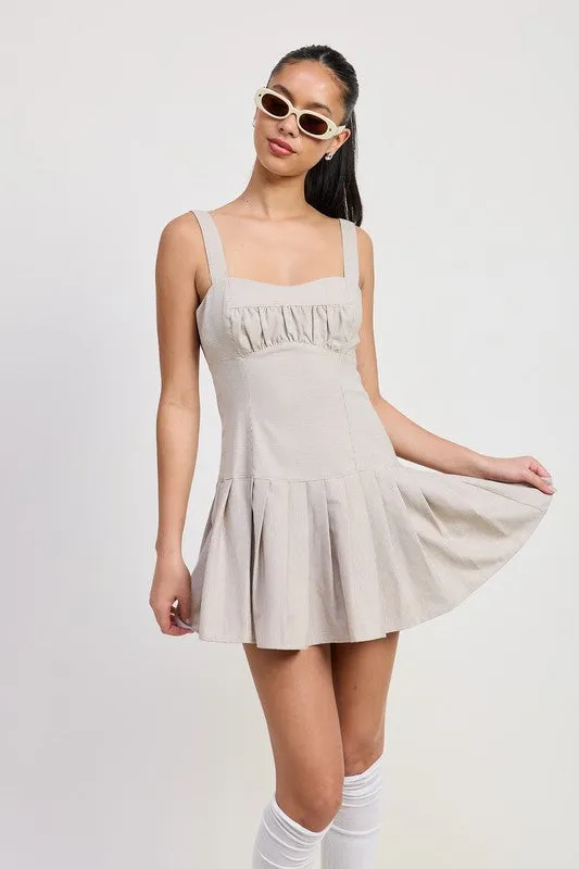 PLEATED MINI DRESS WITH BACK TIES sold by Charming Charlie