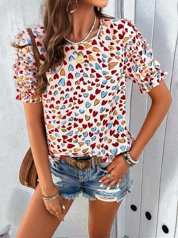Round neck heart print ruffled sleeve top sold by Charming Charlie