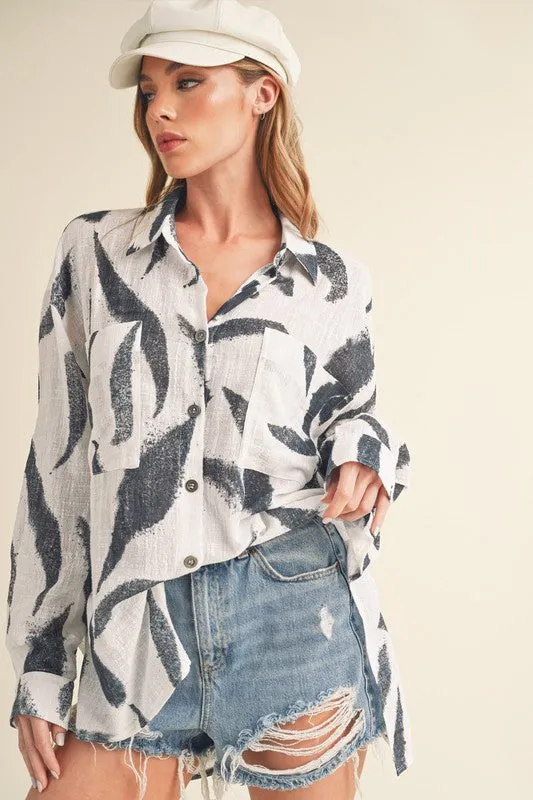 Aemi + Co High-Low Printed Button Up Long Sleeve Shirt sold by Charming Charlie