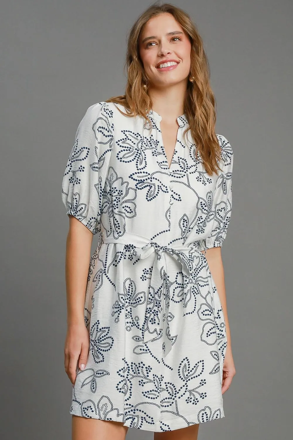 Umgee Full Size Floral Print Notched Puff Sleeve Mini Dress Plus Size sold by Charming Charlie