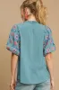 Umgee Full Size Embroidered Puff Sleeve Mock Neck Top Plus Size sold by Charming Charlie