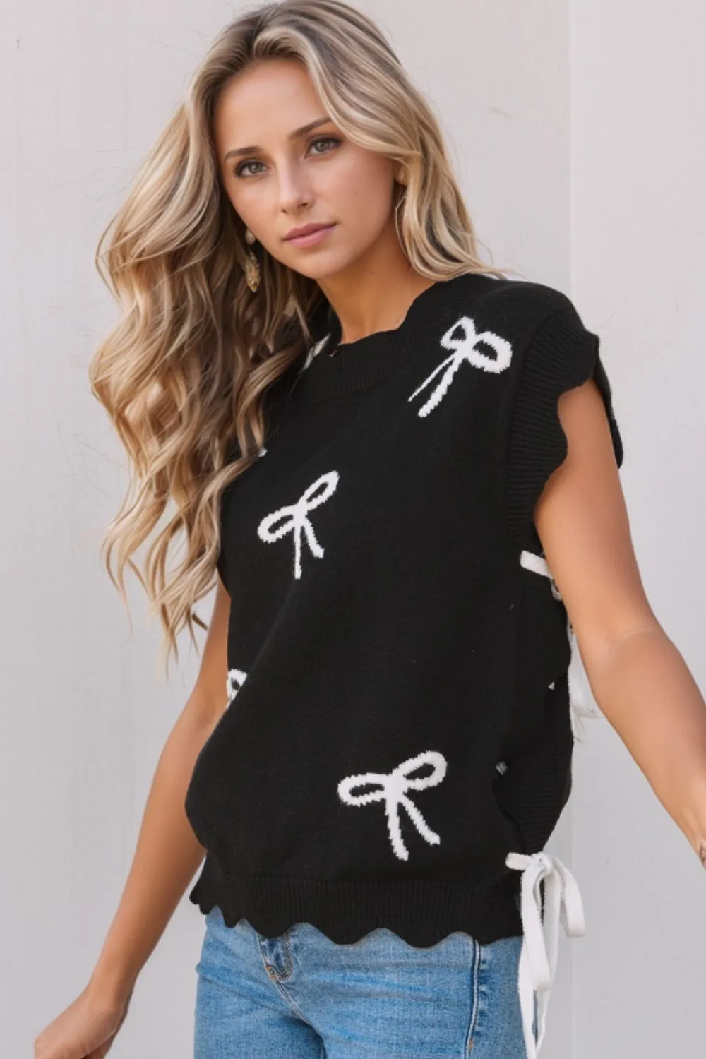 Bow Side Ties Scalloped Hem Cap Sleeve Sweater sold by Charming Charlie