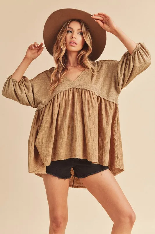 Aemi + Co High-Low Frayed Hem V-Neck Blouse sold by Charming Charlie