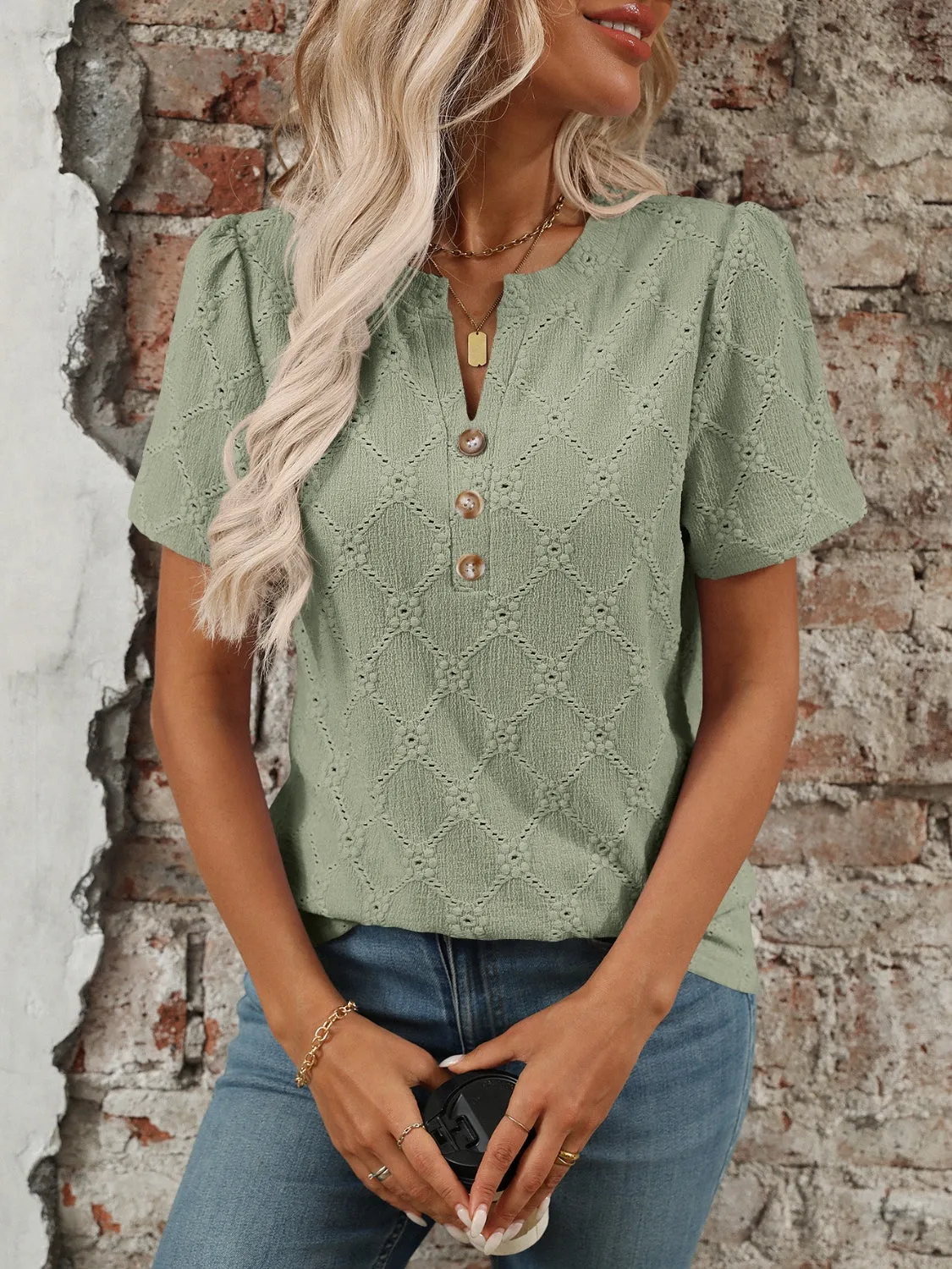 Eyelet Notched Short Sleeve Top sold by Charming Charlie