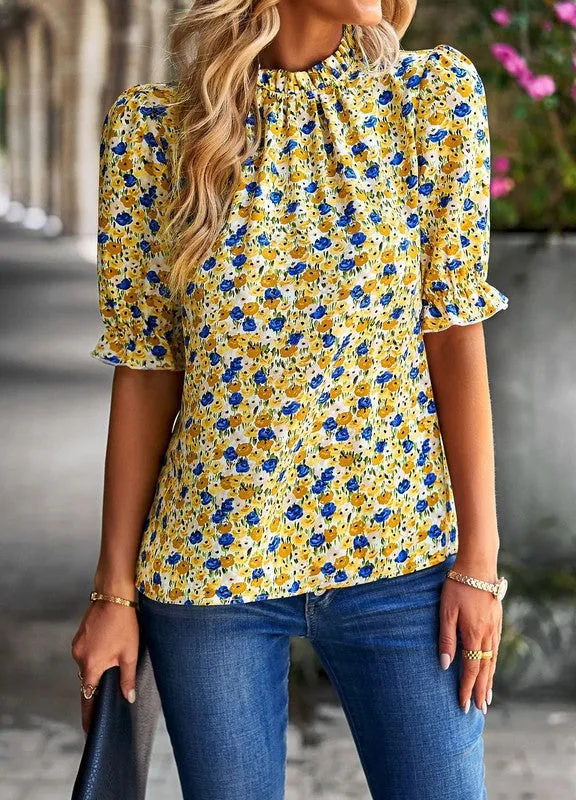 Floral mock neck blouse sold by Charming Charlie