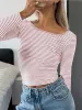 Striped long sleeve open back shirt sold by Charming Charlie