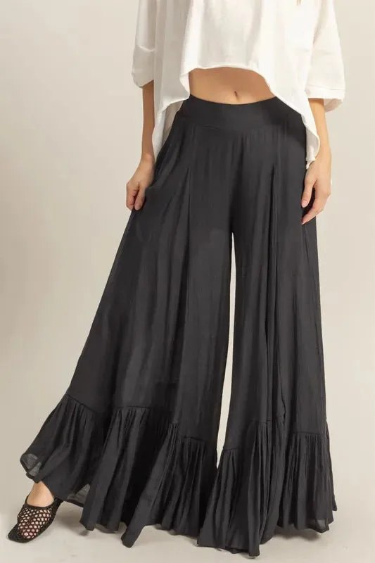 HYFVE High-Waist Ruffle Flared Wide Leg Pants sold by Charming Charlie