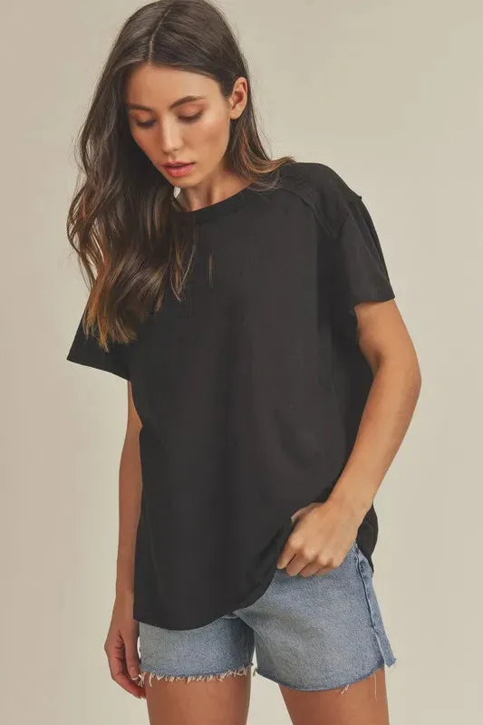 Aemi + Co Exposed Seam Round Neck Short Sleeve T-Shirt sold by Charming Charlie