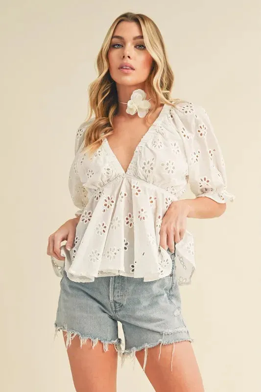 Aemi + Co Eyelet Embroidered V-Neck Half Sleeve Peplum Blouse sold by Charming Charlie