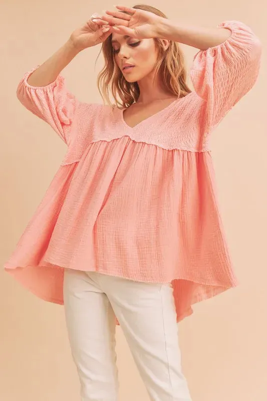 Aemi + Co High-Low Frayed Hem V-Neck Blouse sold by Charming Charlie