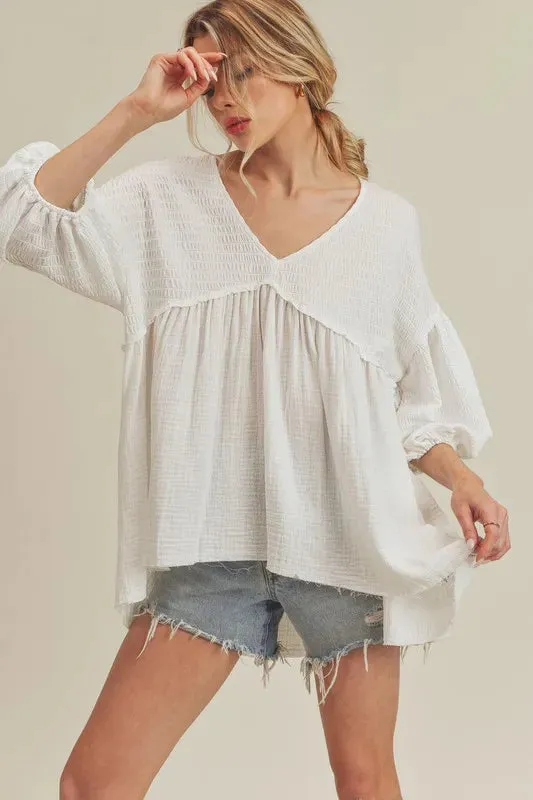 Aemi + Co High-Low Frayed Hem V-Neck Blouse sold by Charming Charlie
