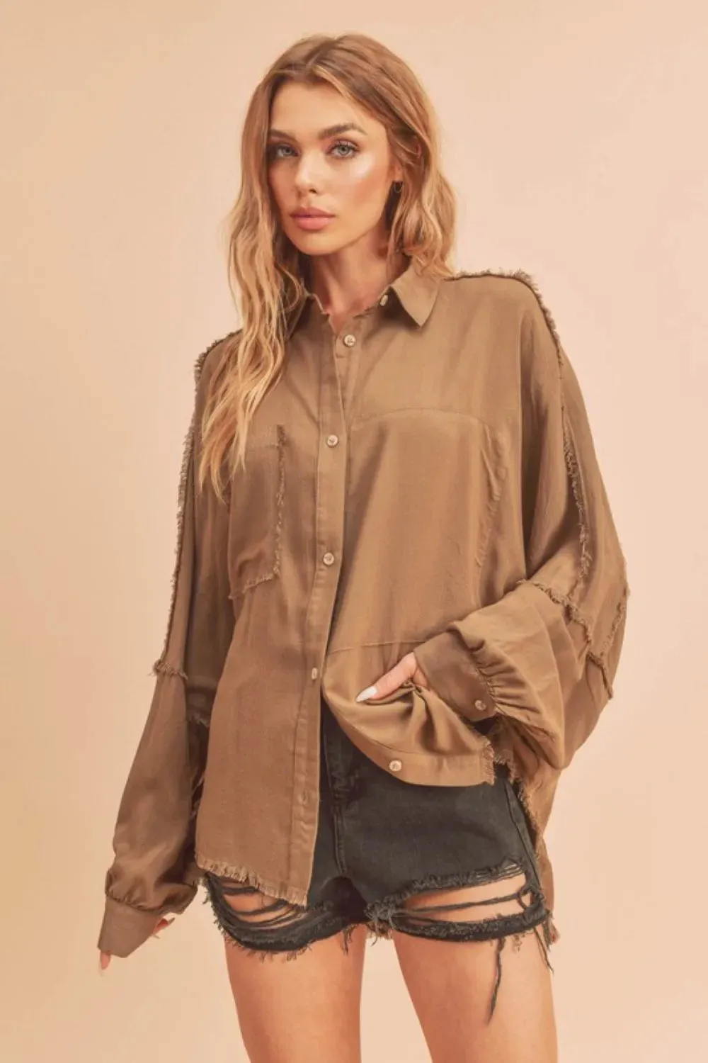 Aemi + Co Raw Edge Exposed Seam Collared Neck Long Sleeve Shirt sold by Charming Charlie