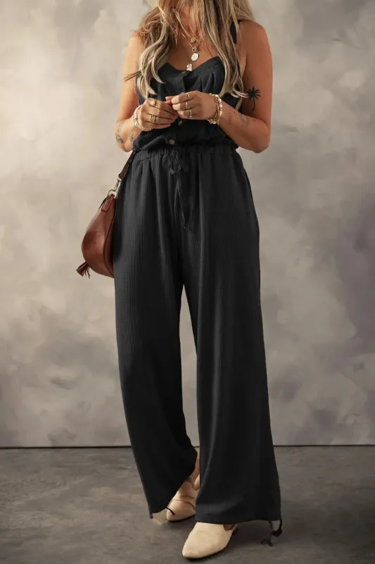 Knotted Straps Button Textured Drawstring Jumpsuit sold by Charming Charlie