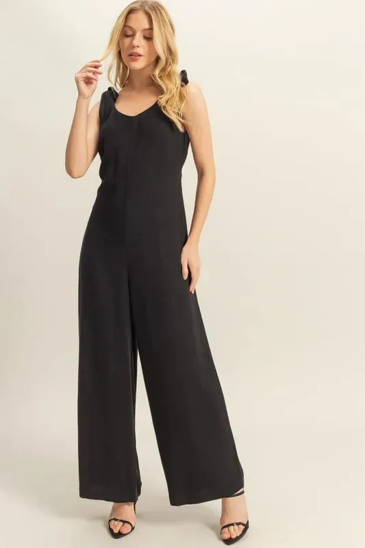 HYFVE Cutout Back Knotted Strap Wide Leg Jumpsuit sold by Charming Charlie