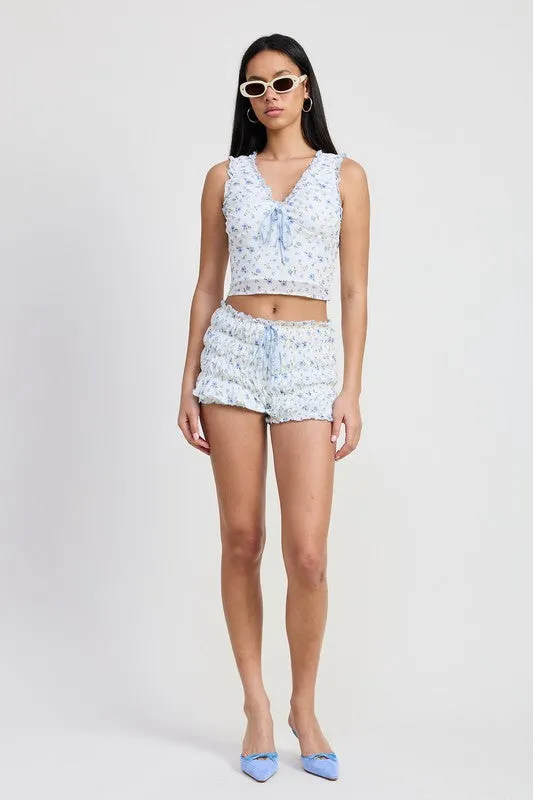 MINI RUCHED BLOOMER SHORTS WITH RUFFLE sold by Charming Charlie