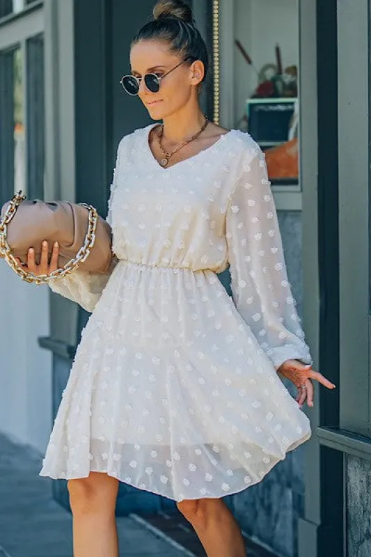 Dotted long sleeve dress sold by Charming Charlie