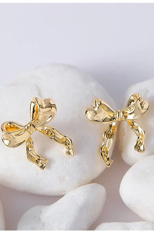 Bow earrings sold by Charming Charlie