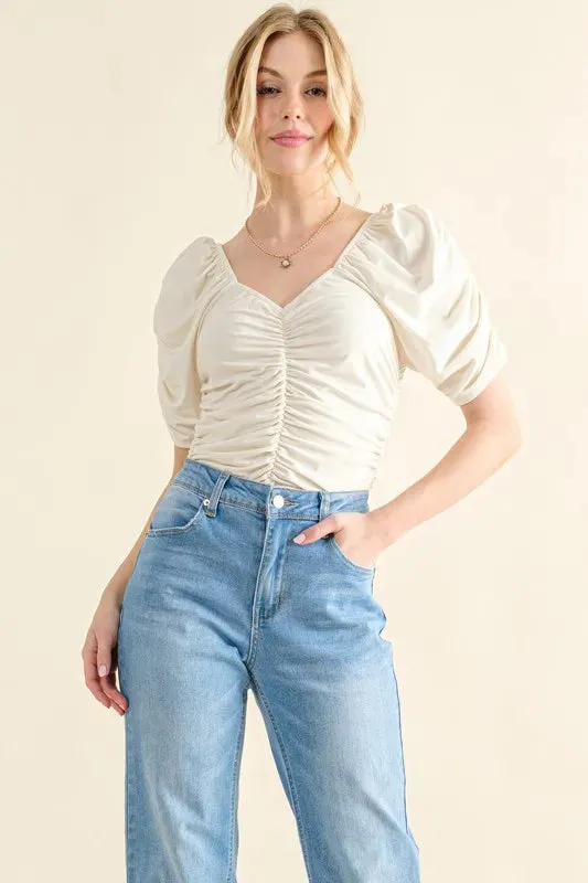 And The Why Buttery Soft Ruched Detailed Jersey Bodysuit sold by Charming Charlie