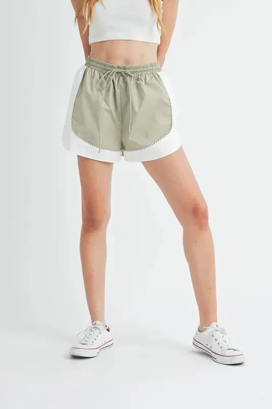 MABLE Drawstring Waist Contrast Trim Detail Shorts sold by Charming Charlie