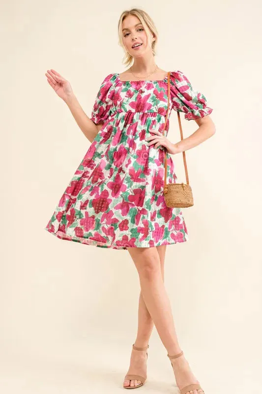 And The Why Smocked Floral Ruffle Short Sleeve Mini Dress sold by Charming Charlie