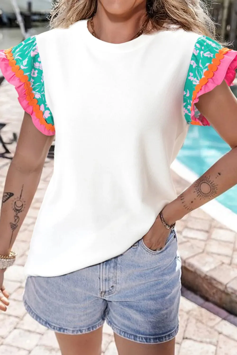 Ruffled Round Neck Cap Sleeve Top sold by Charming Charlie