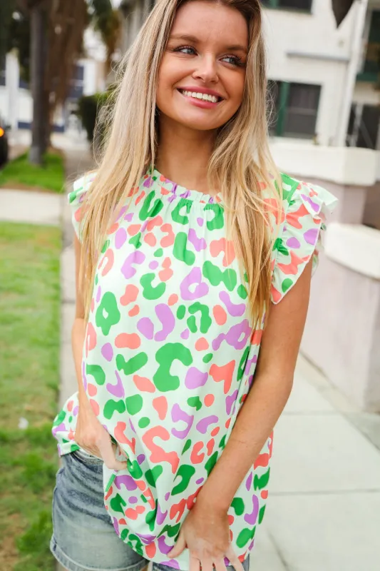 Spread Joy Multicolor Animal Print Mock Neck Flutter Sleeve Blouse sold by Charming Charlie