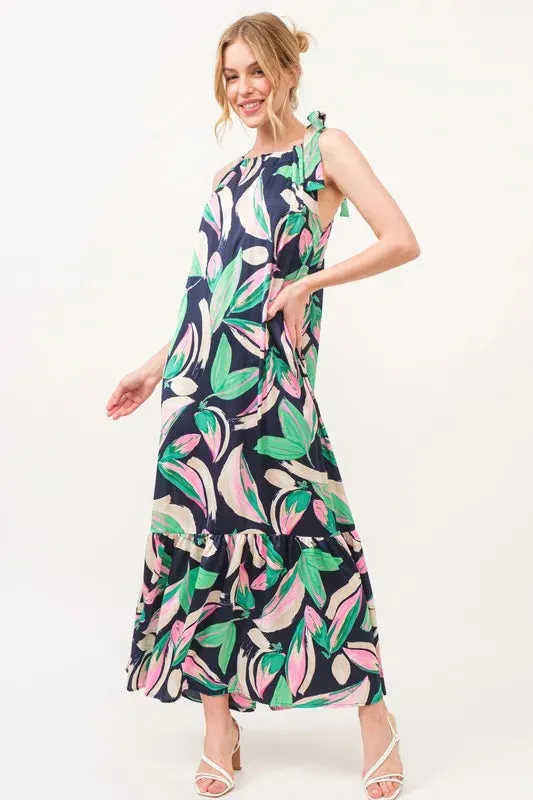 And The Why Botanical Printed Halterneck Tiered Maxi Dress sold by Charming Charlie