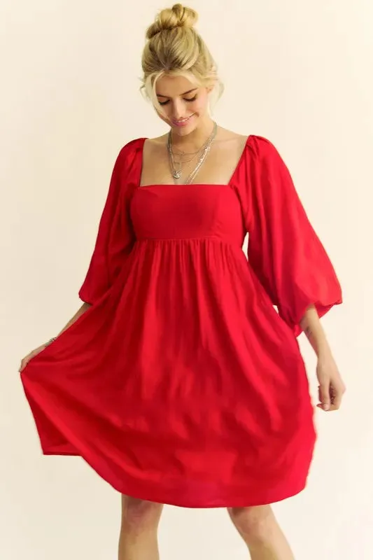 Davi & Dani Solid Textured Fabric Puff Sleeve Tie Back Dress sold by Charming Charlie